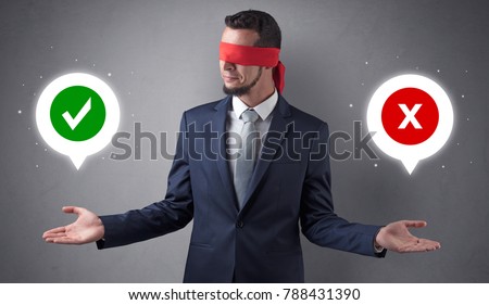 Blindfolded businessman with checked and x mark above his hand