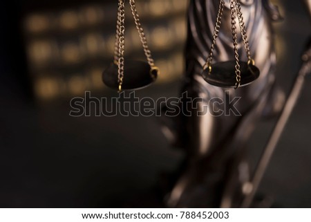Law code. Statue of justice, books. Place for typography.