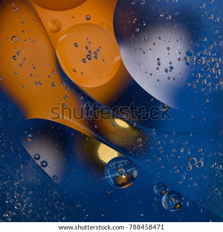 Abstract background in orange and blue color. Large and small spheres in a fantastic space