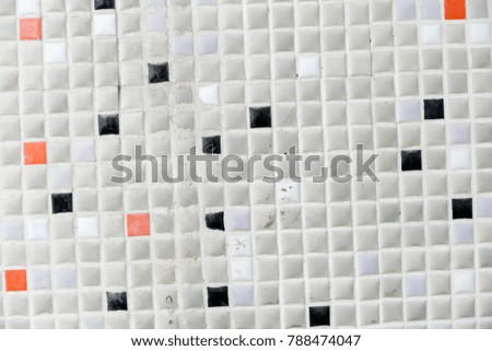 Small white mosaic with dark spots