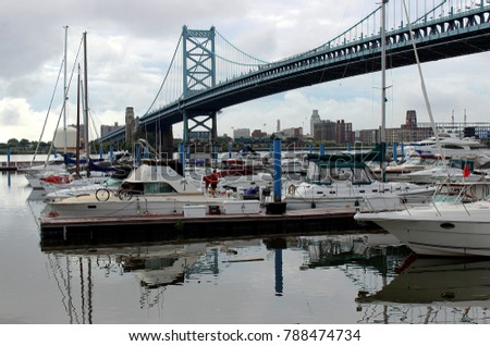 White yacht on the background of the Benjamin-Franklin-Bridge in Philadelphia Pennsylvania USA 2017