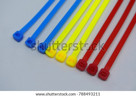 Colorful plastic cable tie strap isolated on white background
