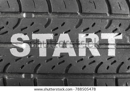 Inscription START on car tire close up. Business conception