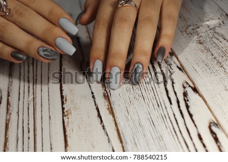 Fashionable design on long nails on the table top