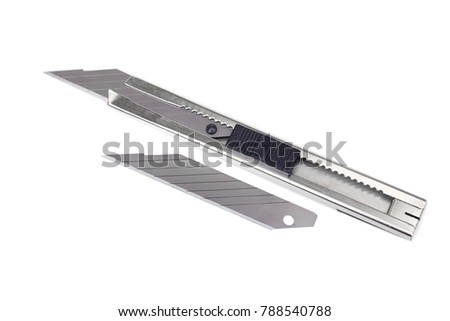  A cutter knife isolated on white                               Royalty-Free Stock Photo #788540788