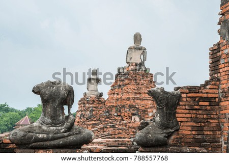 Ruins of the statue buddha at Chaiwatthanaram Temple Ayutthaya , Thailand
