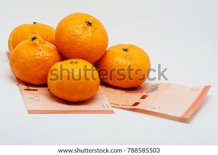 Money and mandarin orange Tangerine yellow citrus fruit healthy Chinese New Year gift  
