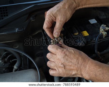 The old man' s hand is holding wrench doing screw fix hex thin nut Royalty-Free Stock Photo #788593489
