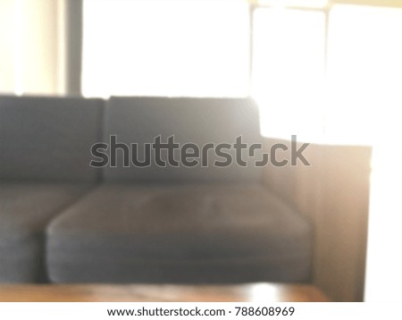 Blurred background of comfortable sofa in modern coffee shop, place for professional youngster hangout together. Sitting in warm light