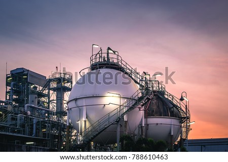 Gas storage sphere tanks in oil and gas refinery plant with sunset sky background Royalty-Free Stock Photo #788610463