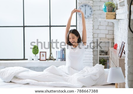 Asian women She is in bed and was waking up in the morning. She felt very refreshed. Royalty-Free Stock Photo #788667388