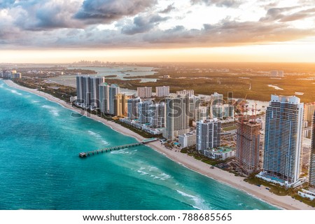 Miami Beach buildings at dusk, aerial view from helicopter.