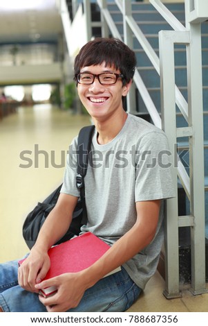 one male college student in the library portrait
