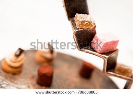 photo of dessert. Assortment of confectionery products on a metal stand