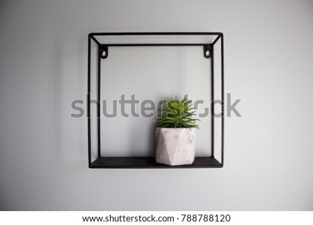 black shelves in loft style on a white wall