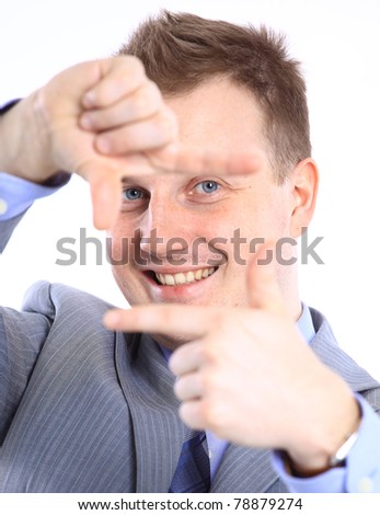 Full length of a handsome business man with hands folded against white background
