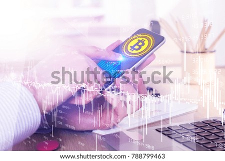 Side view of businessman hands holding and using smartphone with creative bitcoin hologram at desk with city backjground. Technology and cryptocurrency concept. Double exposure 