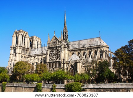 Famous Cathedral of Notre Dame de Paris, Paris, France. On blue sky background. Summer day