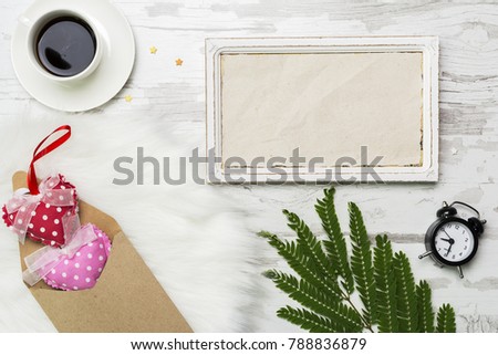Valentines Day Decoration with white horisontal frame, coffe, alarm clock and envelope with hearts . Flat lay mockup love
