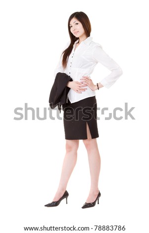 Confident business executive woman of Asian standing and holding her coat, full length portrait isolated on white background.