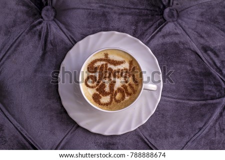 cappuccino in a white cup with an inscription of cinnamon on the milk foam thank you day Royalty-Free Stock Photo #788888674