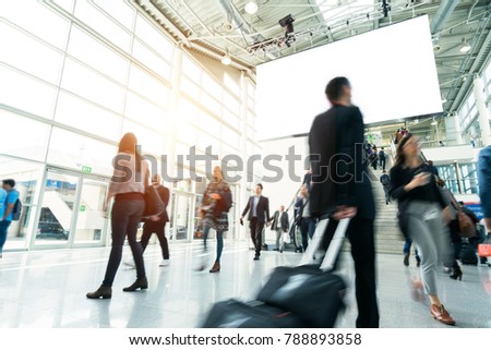 blurred people in a modern hall