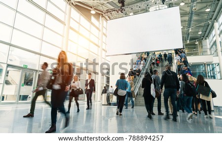 blurred people in a modern hall