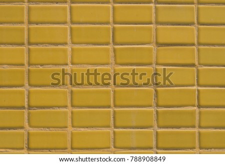 Yellow wall tiles are used for home decoration.