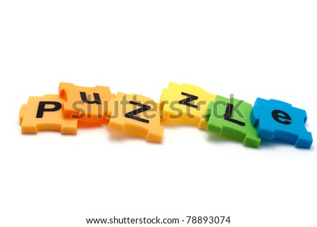 Inscription of colorful puzzles - Puzzle, isolated on white.