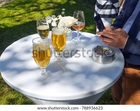 Drinking beer at a garden party