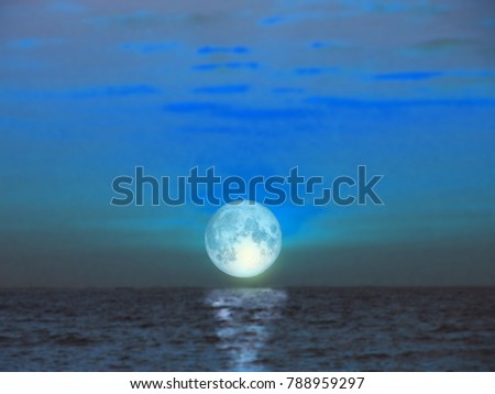 super blue moon rise from the sea in night time