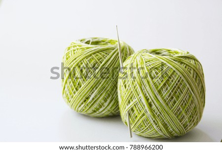 Yarn for knitting and Knitting tool on white  background