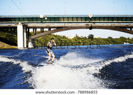 wakeboarding man on the blackboard water