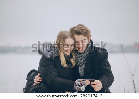 couple in love in the winter forest