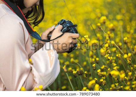 female traveler taking photos using camera