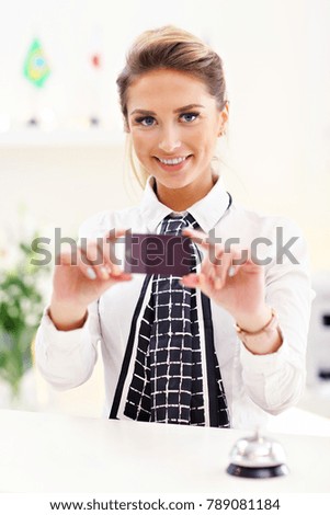 Picture showing happy receptionist working in hotel