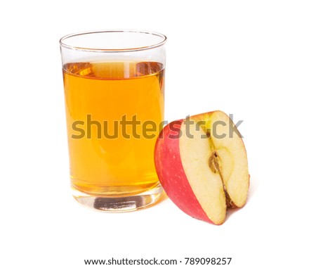 Apple juice in a glass cup and fresh cut apple isolated on a white background