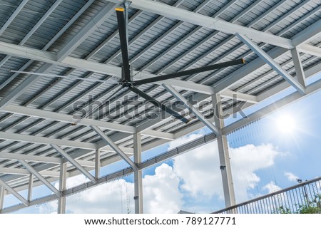 Commercial HVLS Ceiling Fan Big Industrial Fans at roof for hot air cooling and ventilation for shopping mall Royalty-Free Stock Photo #789127771