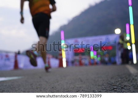 Blurred photo, The runner is running into the finish line.