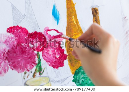 art, creativity and people concept - hand of artist with paint brush painting still life picture