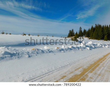 Winter landscapes covered with sun, blue sky and yellow earth