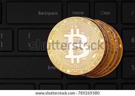 Golden bitcoins and computer kayboard