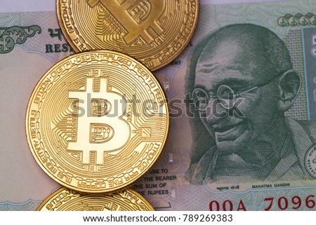 Golden  bitcoin and indian rupee money.