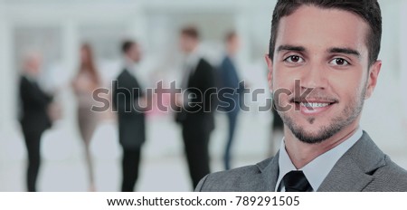 Happy mature business man looking at camera with satisfaction at office