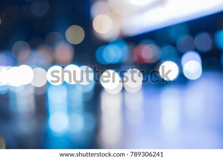 Blurred background street of the night city with car lights and bright signs