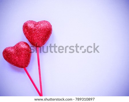 Corner for valentines day with red heart on purple paper background. / with copy space