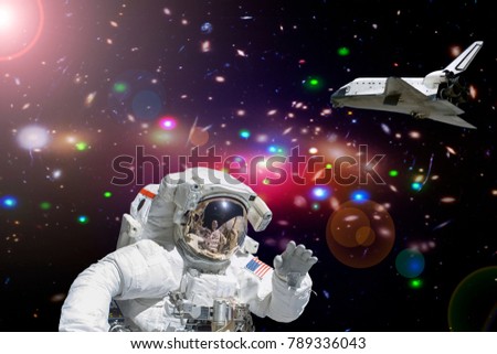Astronaut in the deep space, shuttle on the backdrop. The elements of this image furnished by NASA.
