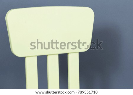 Plastic green chair on black background