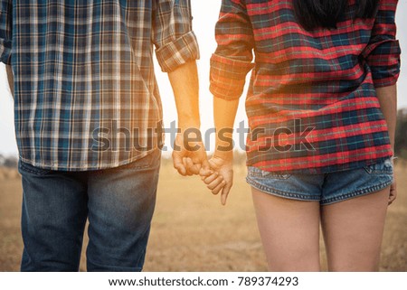 Sweet couple hands together.