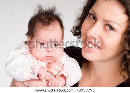 happy cute mom with her baby on white